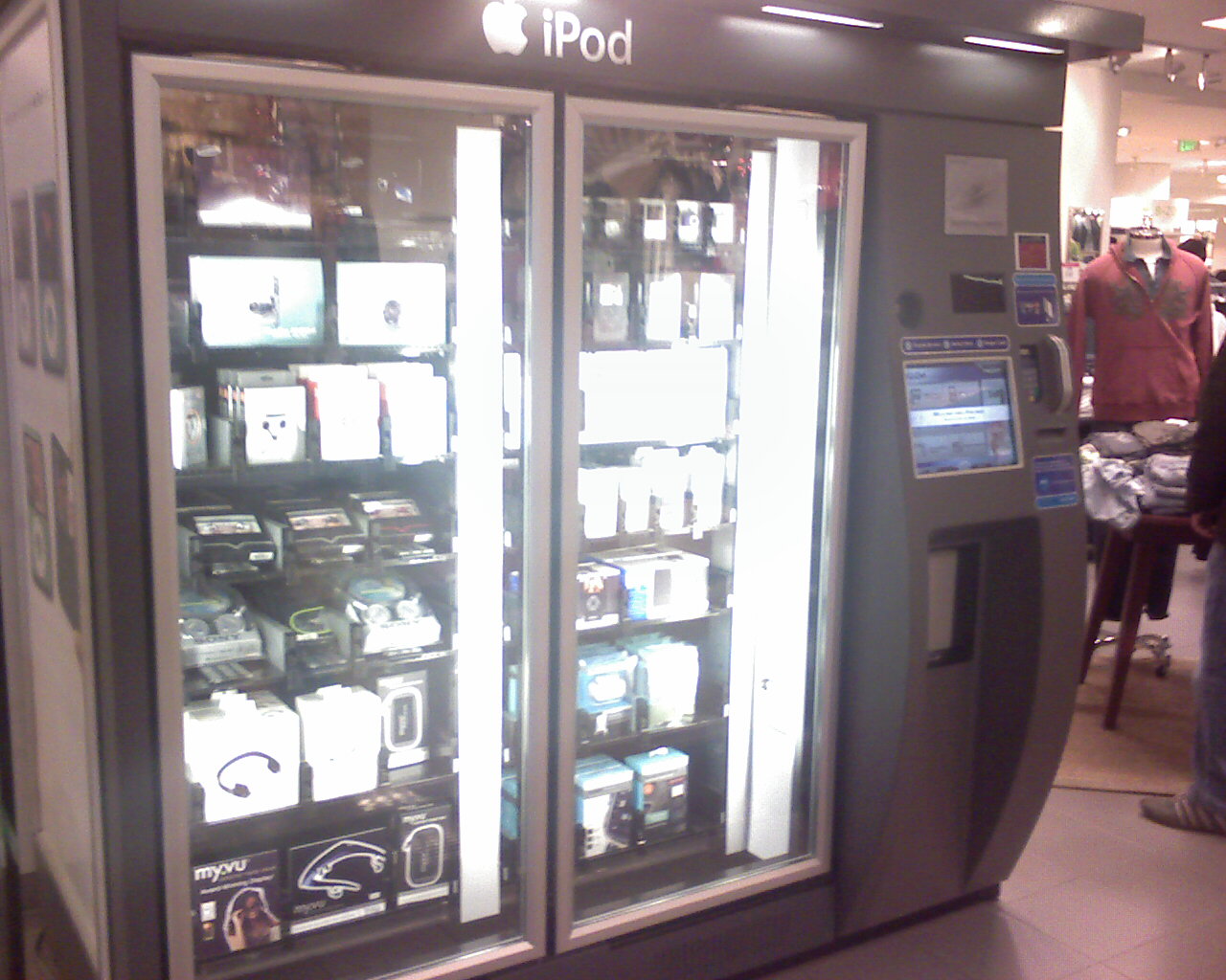 an apple store with refrigerators filled with drinks