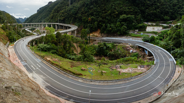 an image of a winding road that runs through mountains