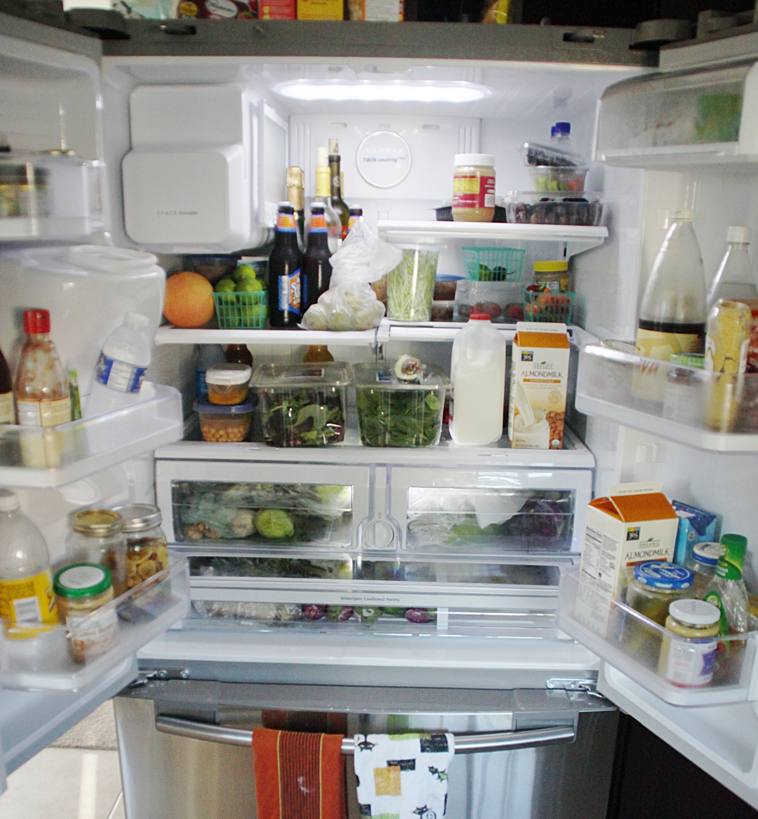 an open refrigerator filled with food and drink