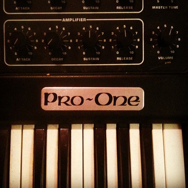 a synthesizer with a sign that says pro - one
