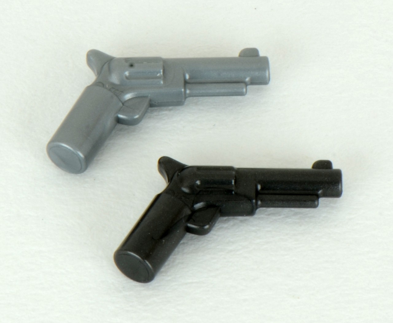 a pair of black metal toy guns