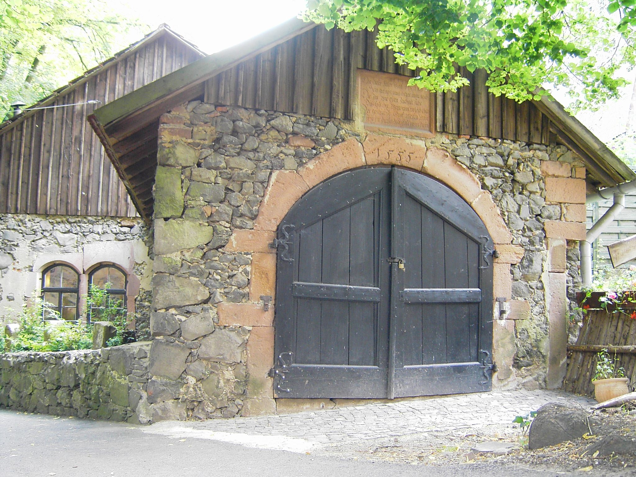 a very old stone structure with a nice wooden door