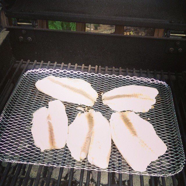 panini being prepared on top of the grill for people to use