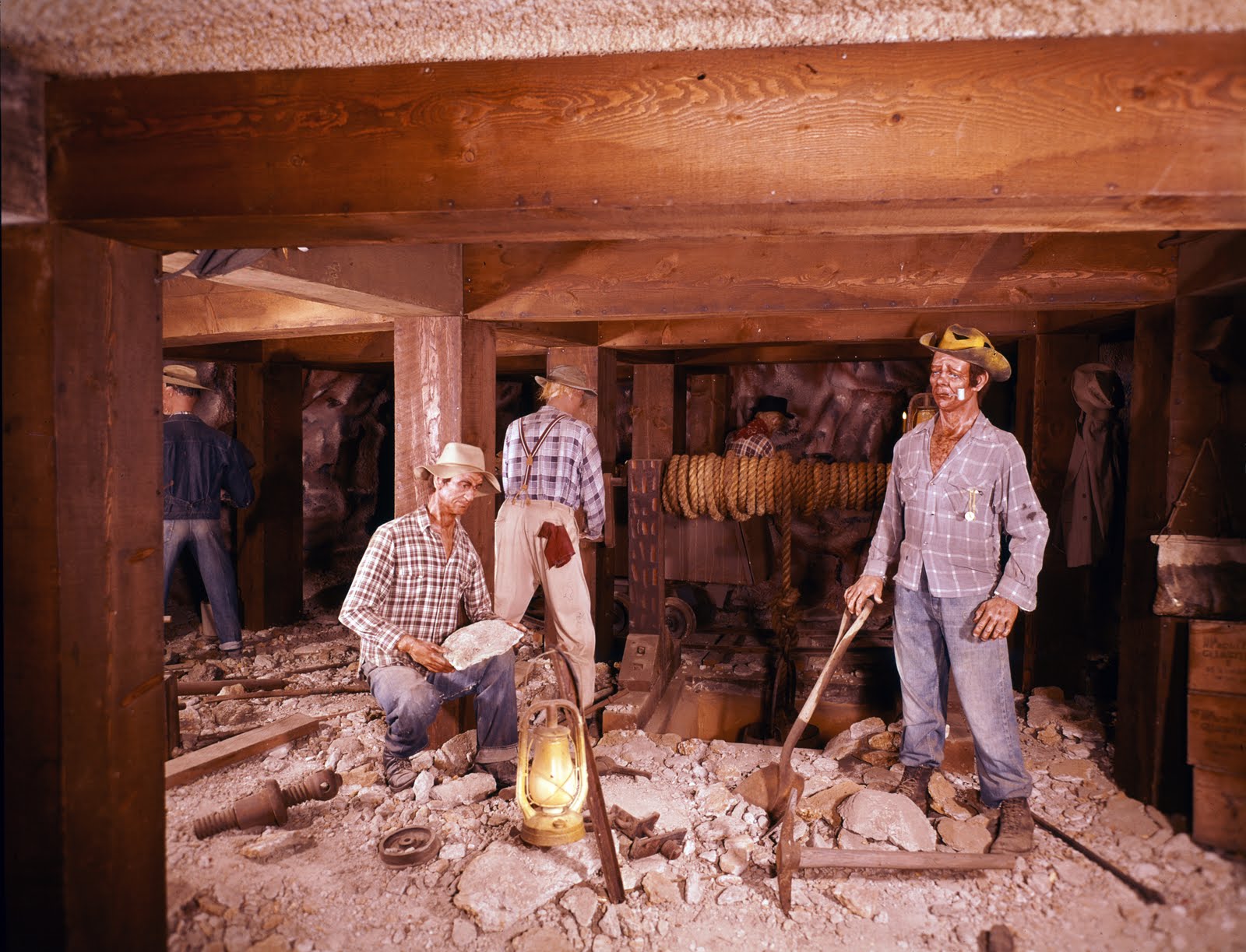several men are working in a room that appears to be under construction