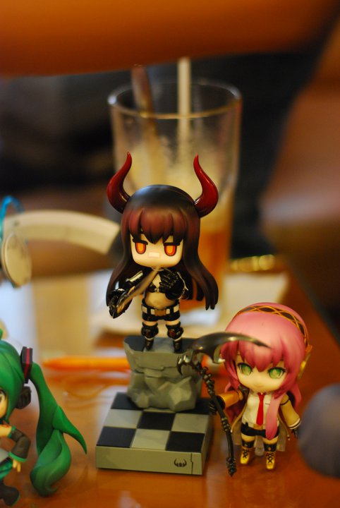 several figurines sit on the table next to each other