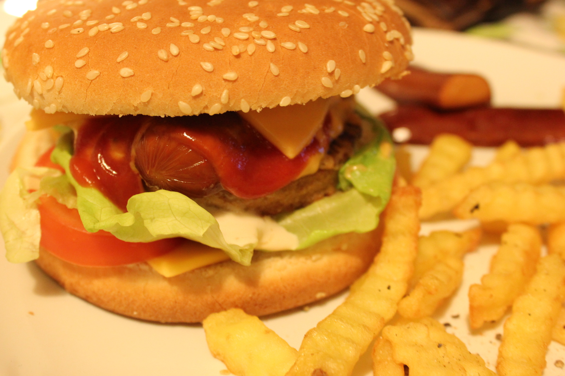 a hamburger and fries on a plate with french fries