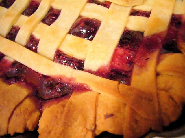 a latticed crust is shown with berries in it
