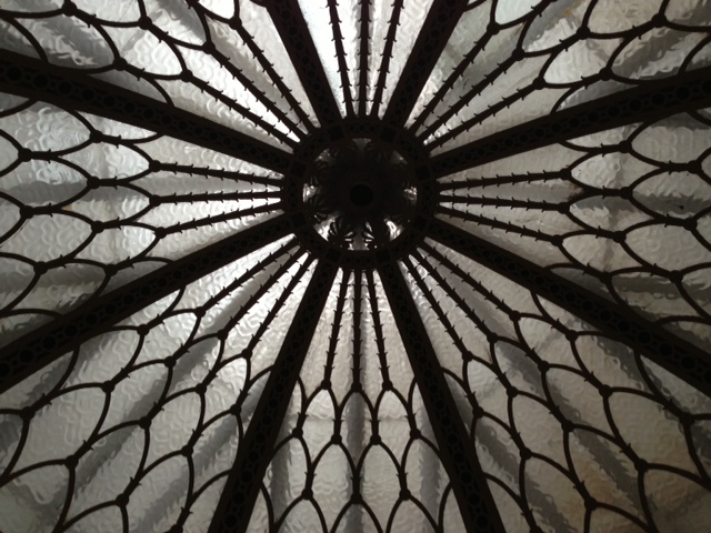 a decorative ceiling with patterns of mesh hanging from the ceiling
