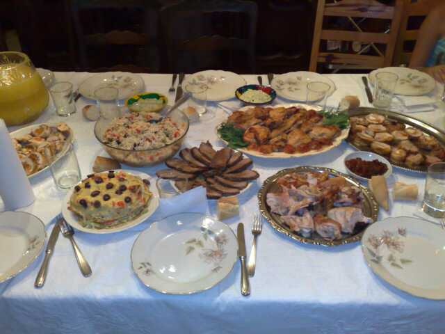 the table is full of different dishes of food