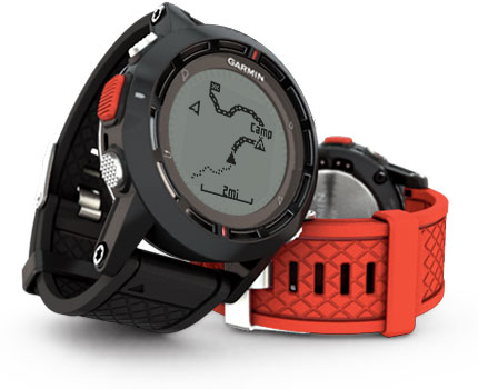 an electronic watch is next to a red wristband