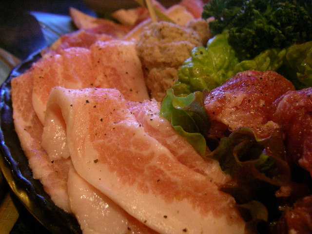 a bowl filled with chicken and broccoli on top of a table