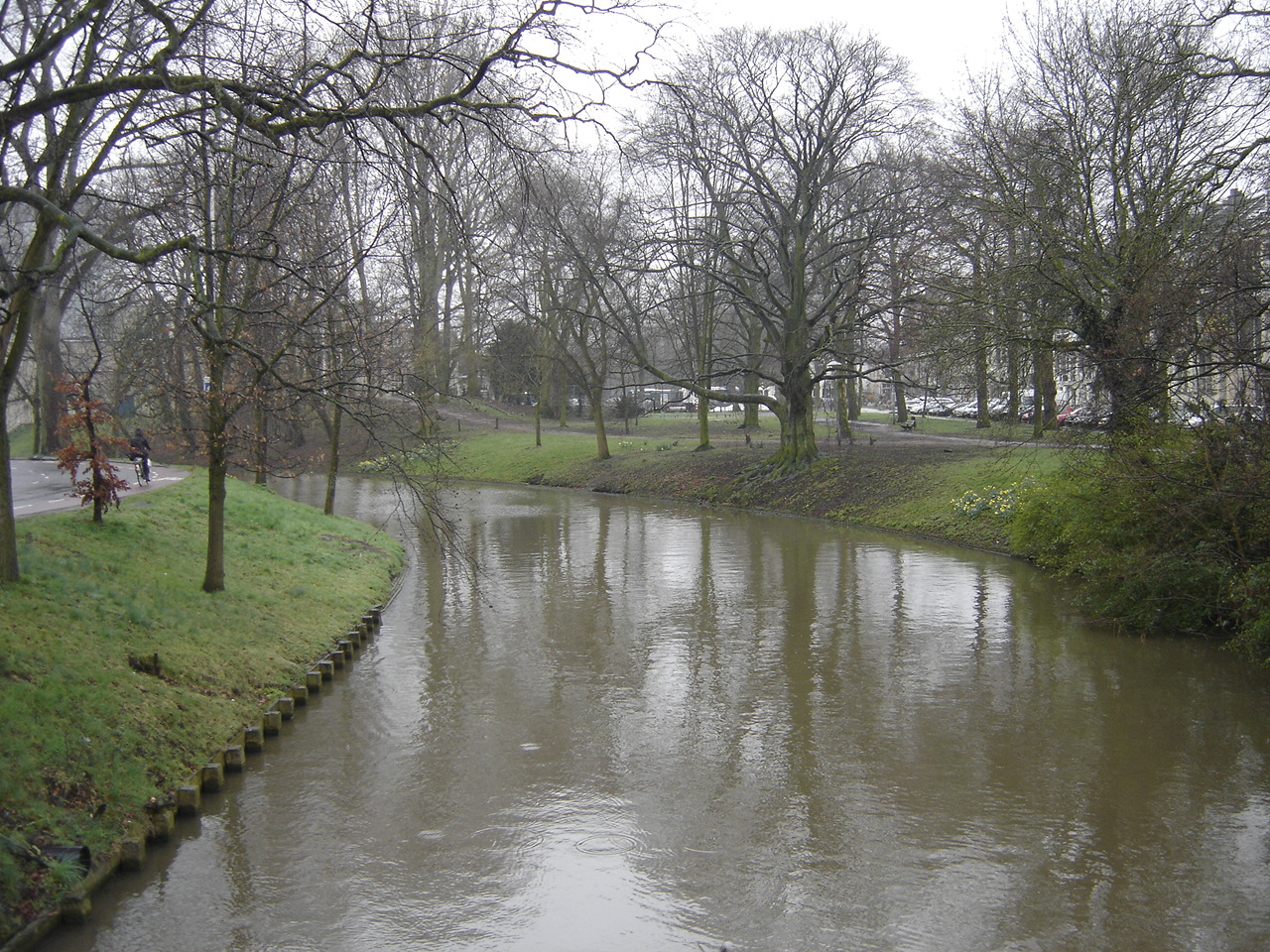 a river flowing down the side of a road