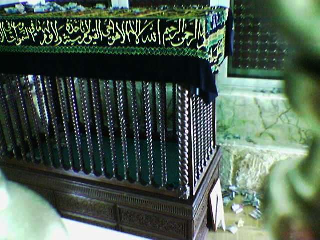 the metal shelf is on display with islamic writing