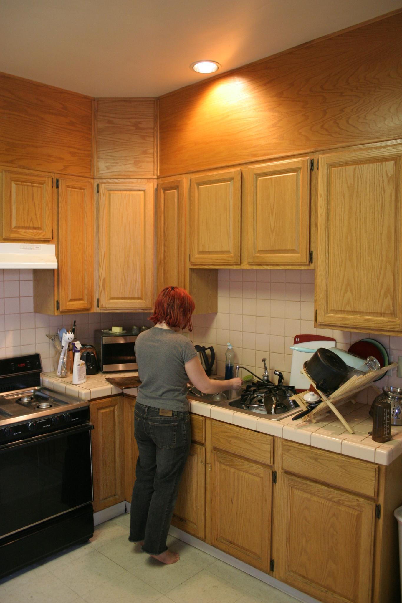 a person is cooking in an empty kitchen