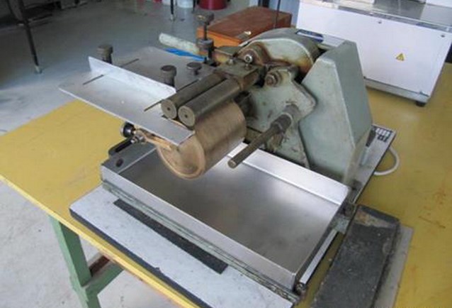 an open machine that is on a work table