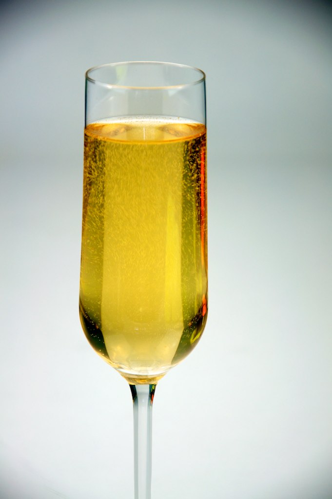 a glass of wine with bubbles on it