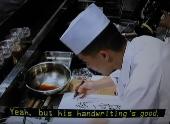 a man in a chef outfit is preparing food
