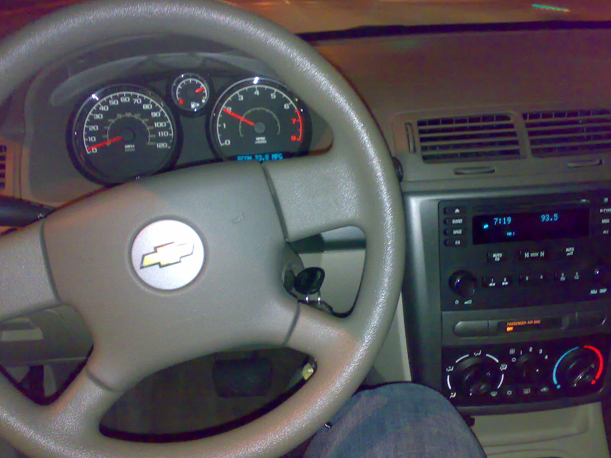 the dashboard of a car, with many gauges on the instrument