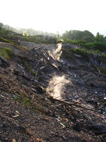a rocky hill is filled with lots of debris
