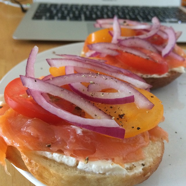 sandwiches on a plate, with pickled onions and salmon
