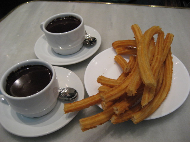 two plates of fries and coffee on a table