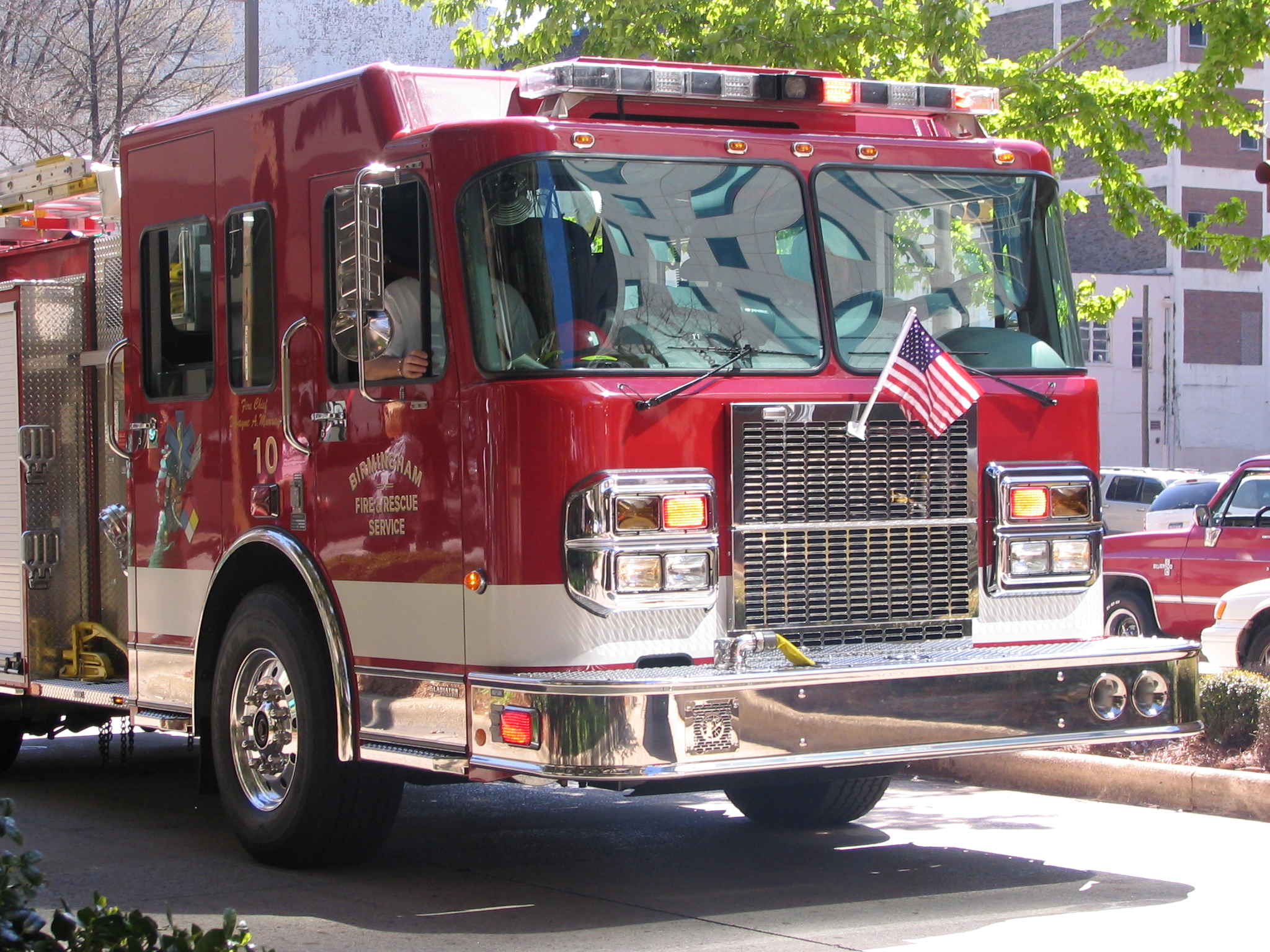 a large fire truck driving down a street