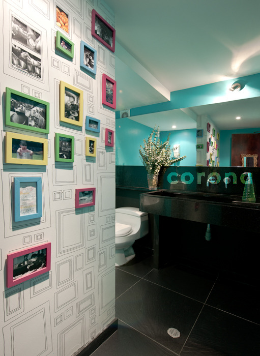 the colorful bathroom has many frames on it