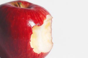 the side of an apple with a bite in it