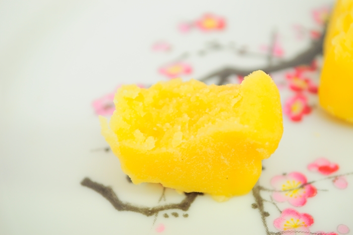 a close - up of a yellow substance on a plate