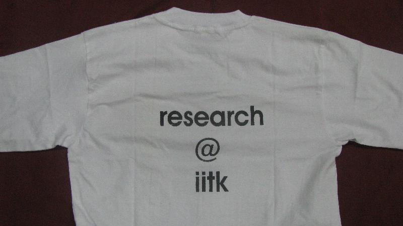 a white shirt with black letters reading research and qlink