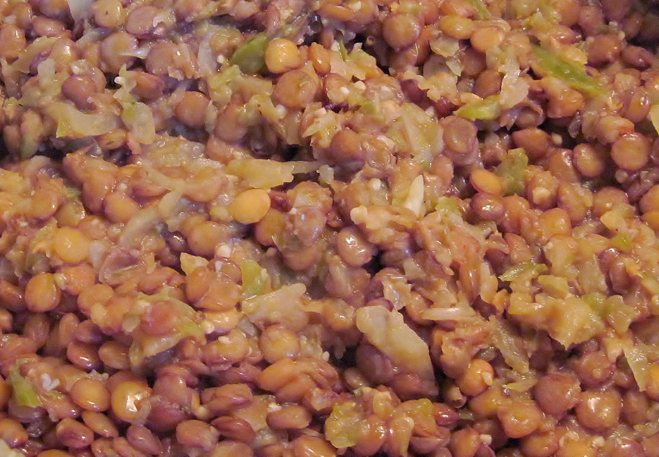 beans and broccoli are mixed together in a mixture