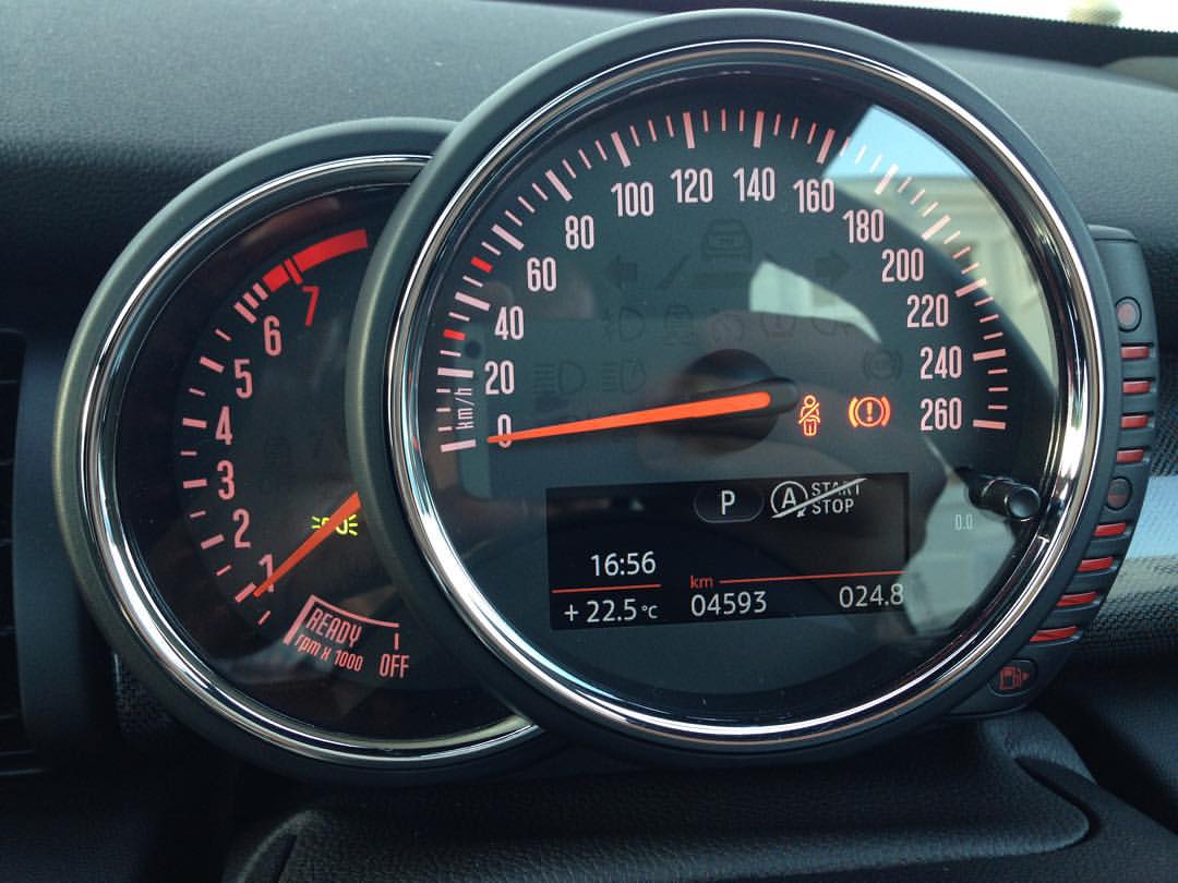 the dashboard of a car shows several meters