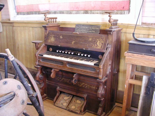 an old pipe organ is in the living room