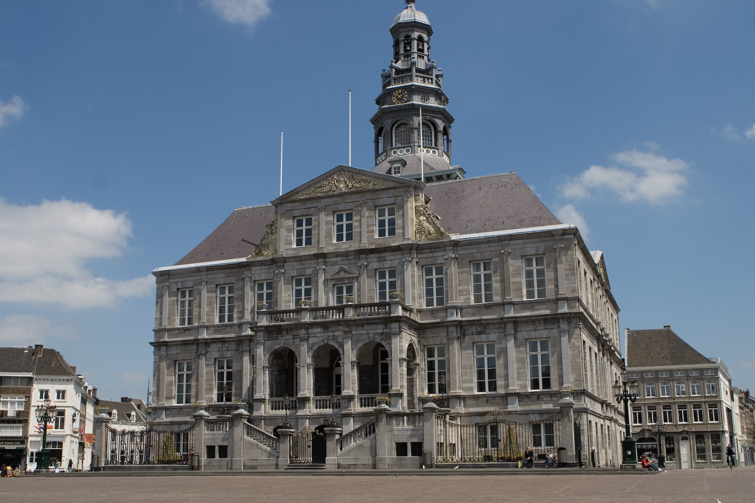 a very large stone building with a tower on top