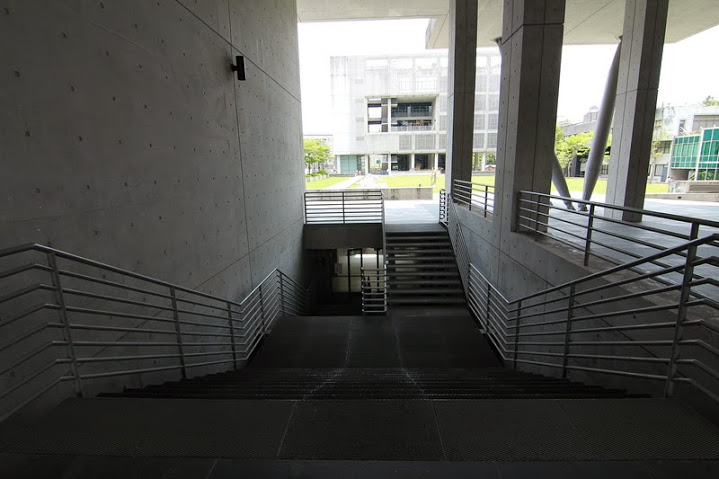 some stairs and a set of stairs in an open building