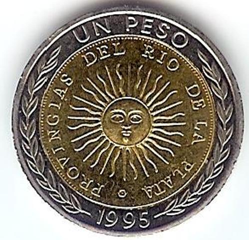 a medallion with the sun symbol on it