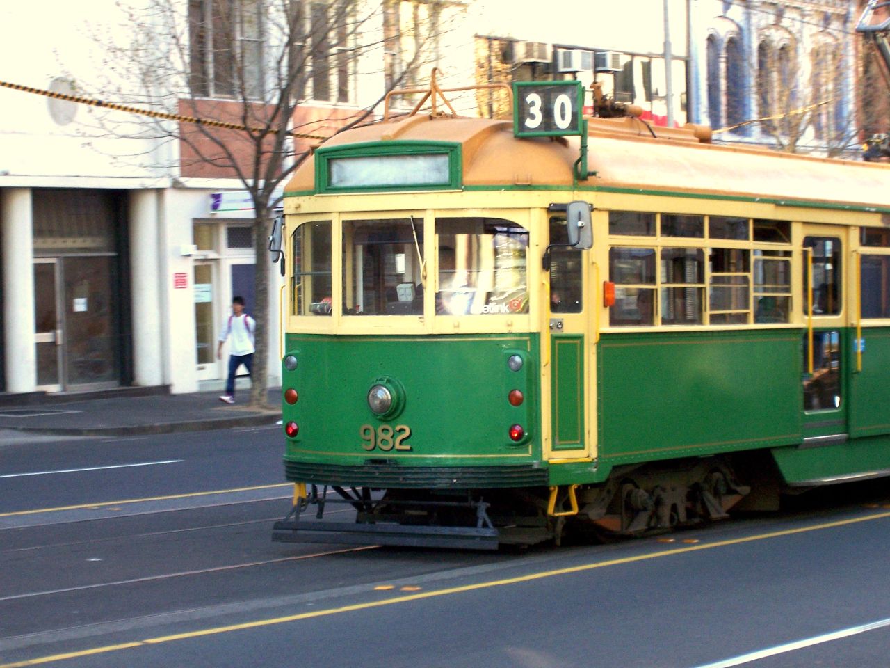 the trolley has stopped in front of a building