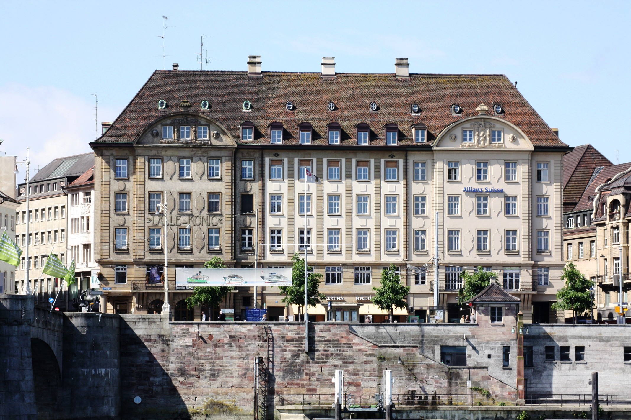 a large building with a bridge in front of it