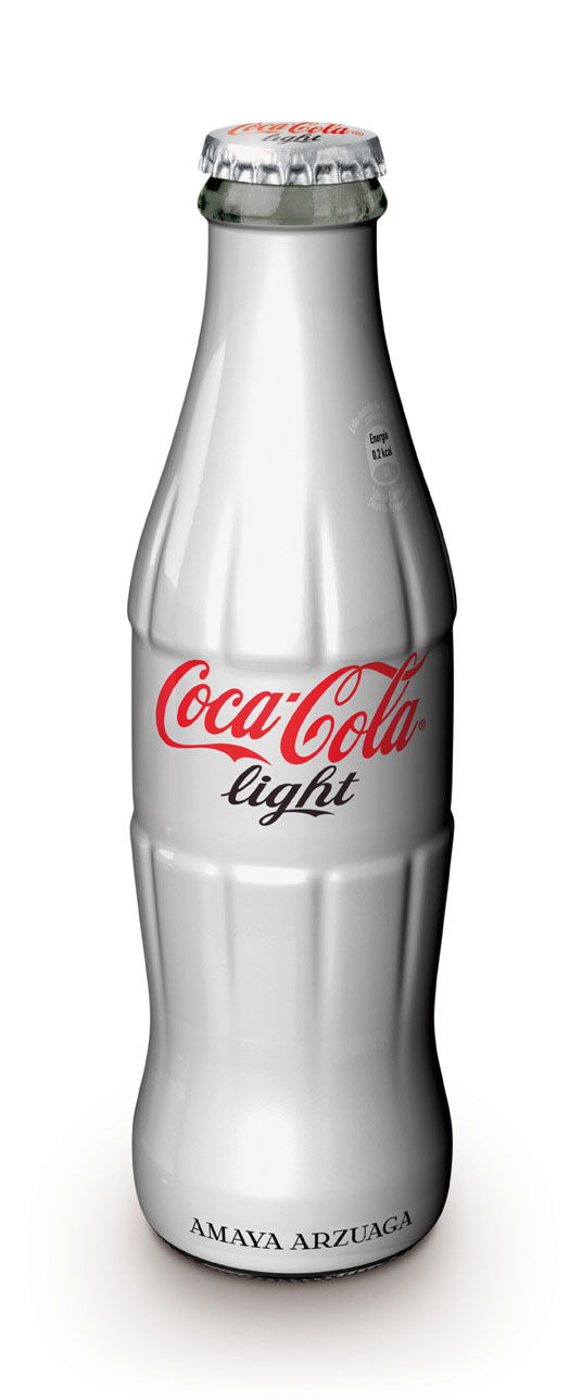 a silver coca cola bottle with the light reflecting off of it