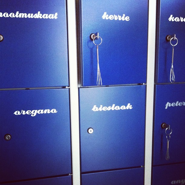 some very pretty blue lockers with some keys hanging from them