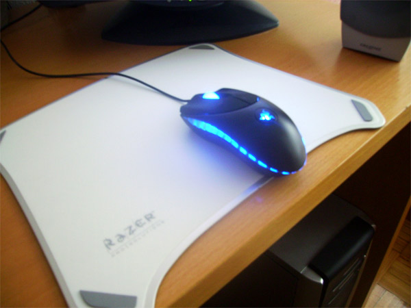 a computer mouse sitting on top of a white paper