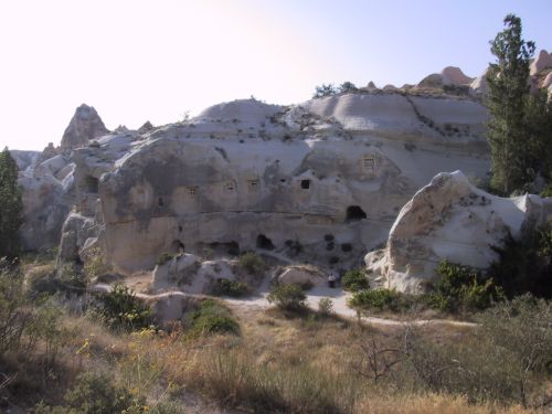 a rocky area with little huts that are made out of rocks