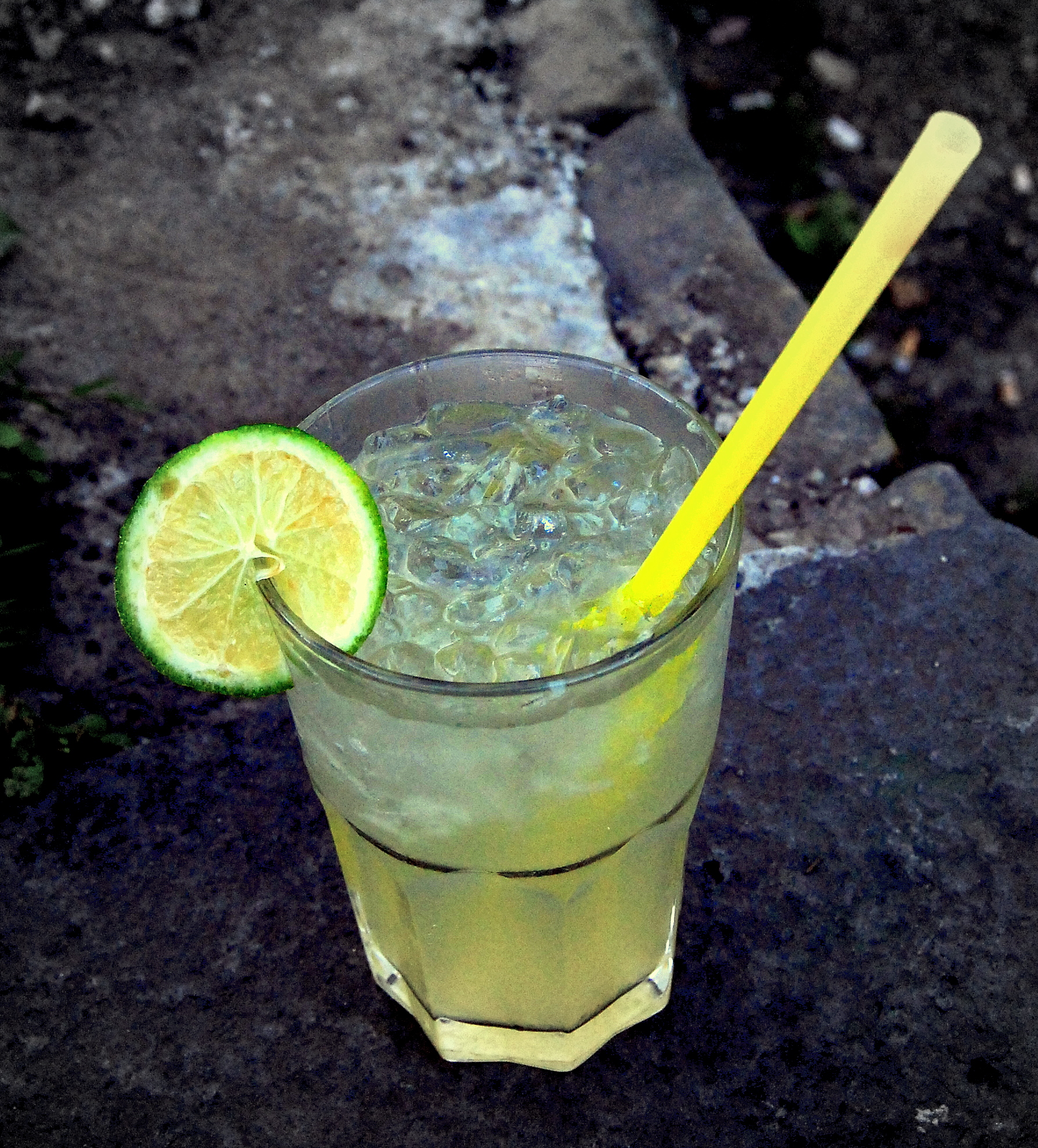 a beverage with a lime slice on the rim