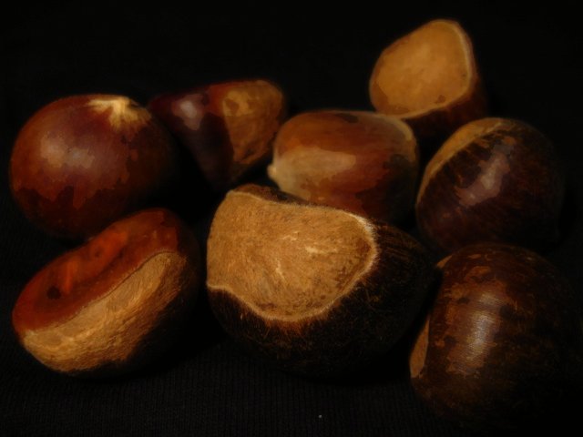 nuts are sitting on the black surface