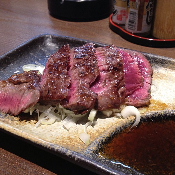 steak sliced up and served on top of a roasting pan