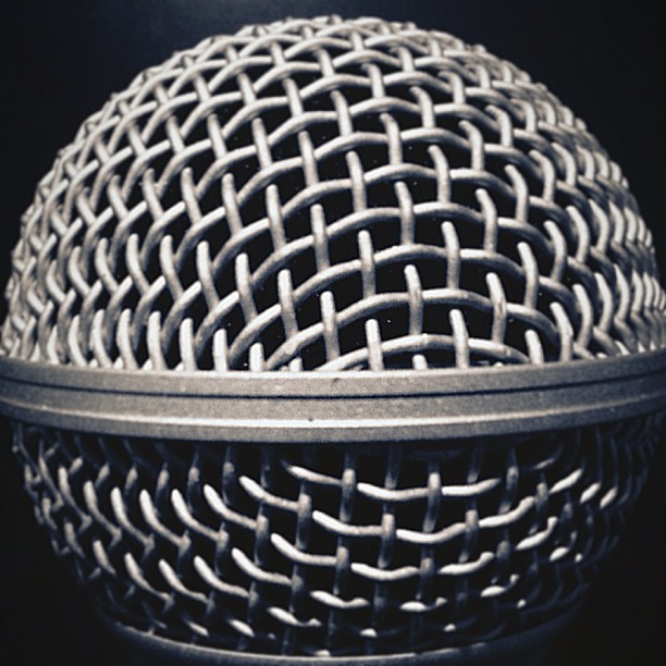 the top of a microphone head, with an abstract pattern