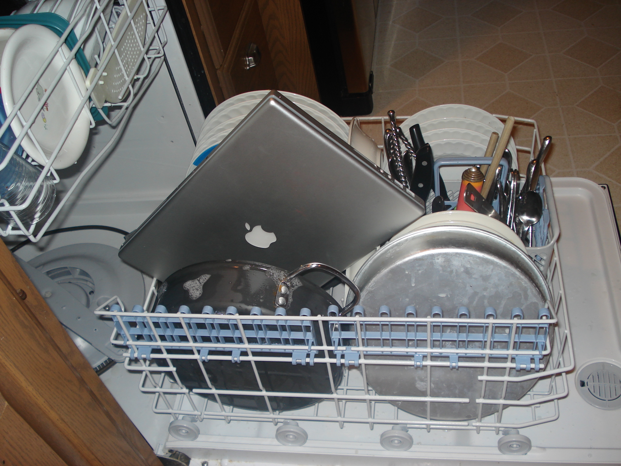 the dishes are in the dishwasher ready to be loaded