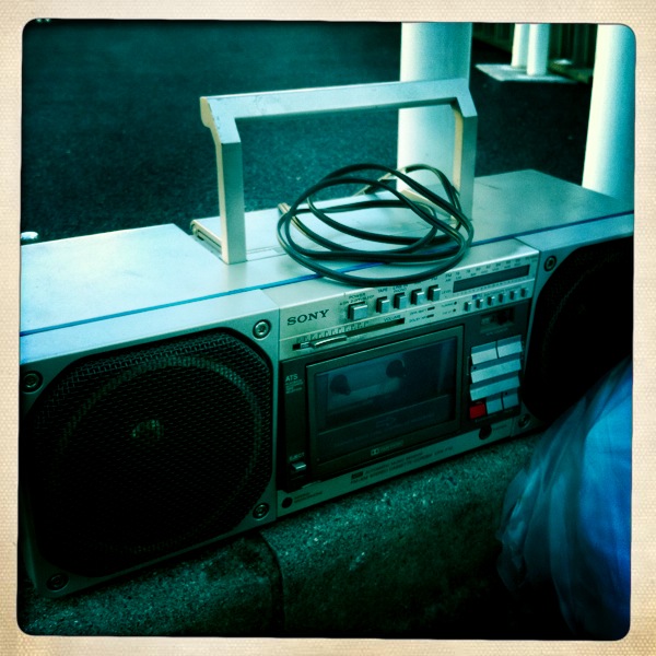 old boombox with two electronic speakers on top