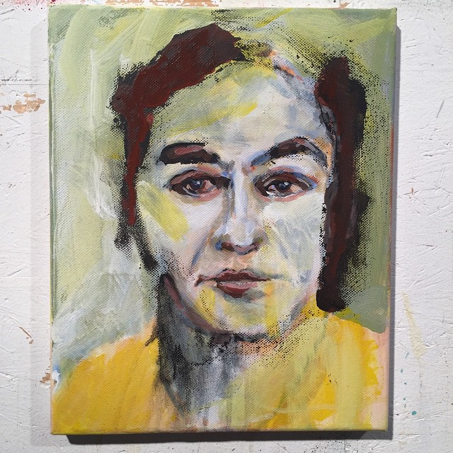an abstract portrait is painted on a canvas