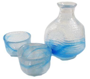 some blue glass items sit on a white surface